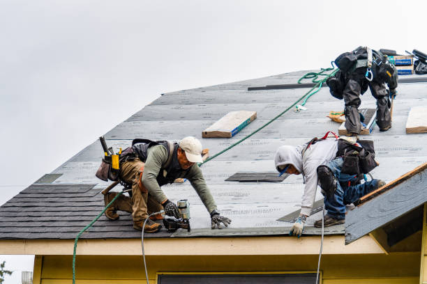 Professional Roof Replacement technician working in Leesburg, IN